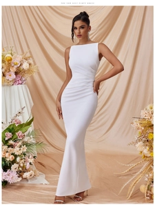 Close-up of white sleeveless bodycon maxi dress with side slit and waist pleats