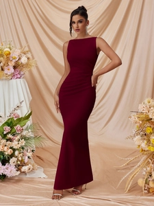 Detailed close-up of a sleeveless burgundy slim fit maxi dress with elegant fishtail hem