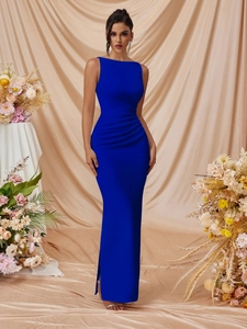 Detailed view of the side waist pleats and slim fit draping on this royal blue maxi dress