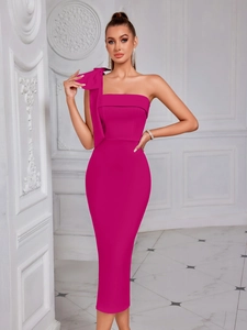 Detail of elegant one-shoulder rose red dress featuring a large bow and slim fit cut
