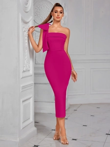 Detail of the oversized shoulder bow and elegant magenta fabric on the formal midi dress