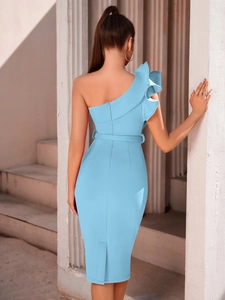 Back view of light blue one shoulder ruffle midi dress with belt and back slit detail