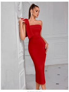 Detail of elegant red one-shoulder party dress with a large bow on the shoulder