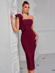 Close-up of the elegant wine red shoulder bow detail on a formal midi evening dress