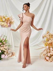 Elegant one shoulder champagne pink evening gown with ruffles and side slit detail