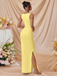 Elegant sleeveless bodycon dress in vibrant yellow with high side slit and open back design