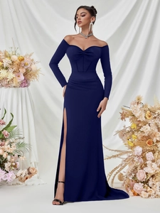 Detail of navy off-shoulder evening gown featuring sweetheart pleats and a high slit