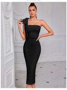 Close-up of elegant black one-shoulder party dress featuring a large bow and slim fit
