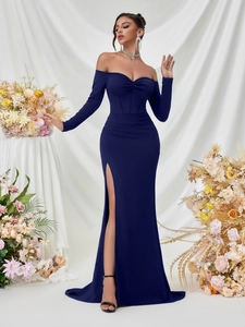 Detail of elegant dark blue off-shoulder long-sleeve dress with twisted pleat bust and high slit