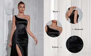 Detail of black one-shoulder evening gown with diamond trim and high-slit satin fabric