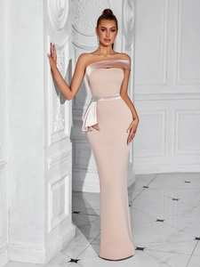 Pink slim-fit evening gown with rhinestone waist detail and silk trim on an elegant model