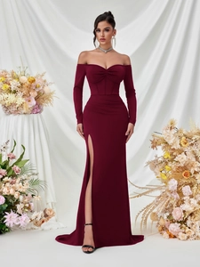 Detailed front view of elegant burgundy off-shoulder evening gown with side slit detail