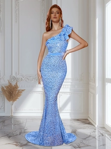 Detail of light blue sequined fisheye gown with ruffled shoulder and satin waist belt