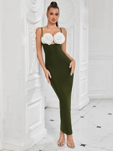 Detail of elegant dark green bodycon maxi dress with large 3D white rose flower accents