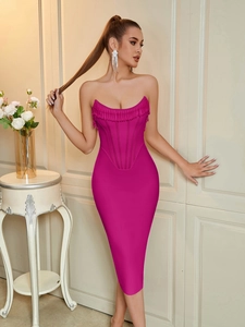 Detail shot of hot pink bandage dress with corset bone structure and fringe neckline