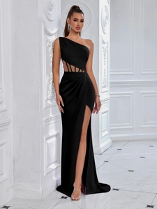 Elegant black one-shoulder slit evening gown with waist cutout detail in formal setting