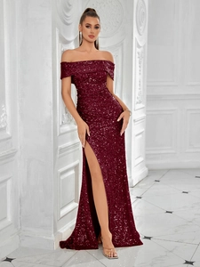 Detail of burgundy sequin evening gown showing off-shoulder neckline and high slit design