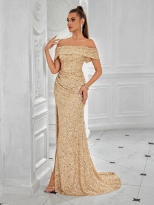 Detailed view of the sparkling gold sequins and elegant off-the-shoulder neckline design