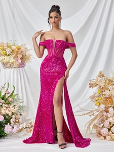 Close-up of sequined rose red off-shoulder gown featuring sheer mesh corsetry and high slit