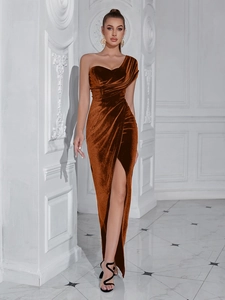 Close-up of caramel velvet evening gown with one-shoulder design and high slit detail