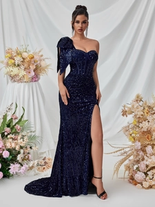 Detailed view of dark blue sequined one-shoulder evening gown with side slit design