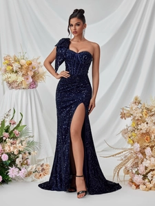Detail of blue sequined evening gown showing one-shoulder bow and boned bodice structure