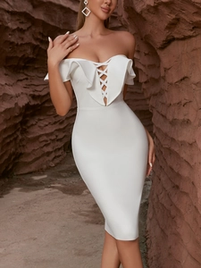 Elegant white off-shoulder bodycon bandage dress with ruffle detail in desert canyon setting