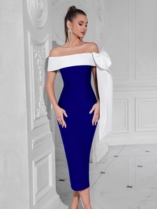 Détail d'une robe de soirée élégante à une épaule avec un grand nœud blanc et contraste