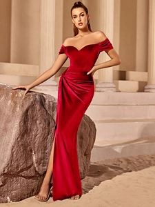 Detail of elegant burgundy velvet dress showing sweetheart neckline and off-shoulder style