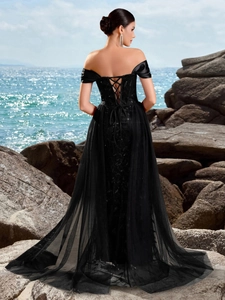 Elegant black strapless evening gown with sequin embroidery and lace-up back design