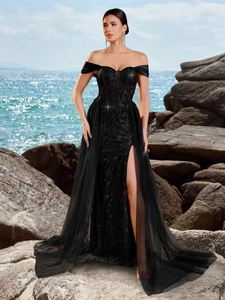 Elegant off-shoulder black evening gown with sequin leaf patterns and mesh slit skirt