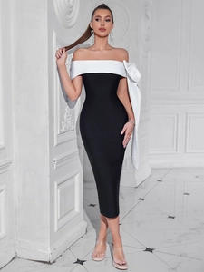 Robe bandage chic noir et blanc avec un grand nœud sur l'épaule et coupe moulante