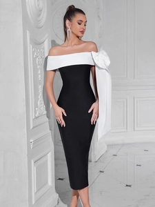 Robe bandage chic noir et blanc avec un grand nœud décoratif sur l'épaule gauche
