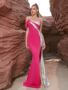 Detailed view of fuchsia evening dress with silver sequins and side slit in desert canyon