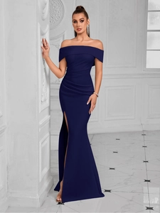 Detail of navy blue off-shoulder evening dress featuring pleated waist and side slit