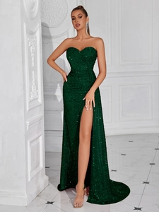 Detail of emerald green sequin tube gown with sweetheart neckline and high leg slit