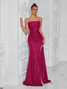 Detailed close-up of fuchsia sequin dress featuring a high-slit and slender straps