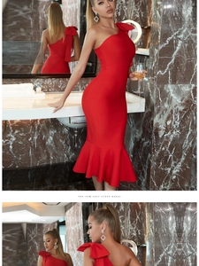 Detail view of red one-shoulder dress featuring oversized bow and mermaid hem