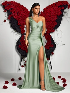 Detail of light green satin one-shoulder evening gown with side slit and waist pleats