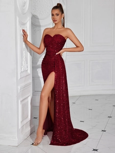 Elegant strapless sequin evening gown in burgundy with a high slit and floor length