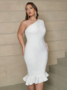 Detail of white one-shoulder evening dress featuring ruffled fishtail hem and slim fit cut