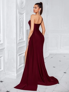 Detailed side view of the elegant dark red evening dress with side slit and long train