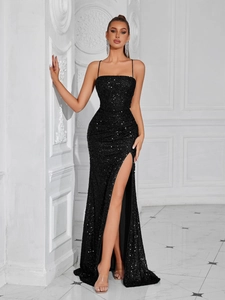 Close-up of high side slit on elegant black sequin evening gown with shimmering texture