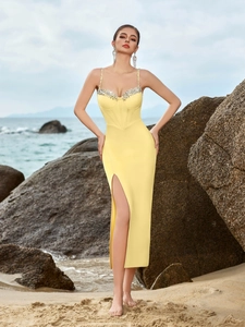 Elegant bright yellow bodycon dress with silver rhinestone bustier and high side slit