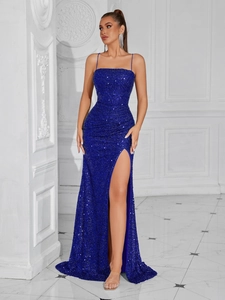 Royal blue sequin evening dress with thin straps and a side slit for formal events