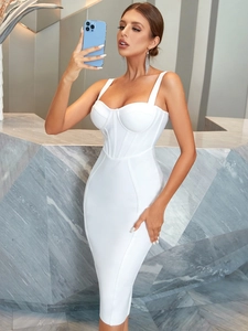 Detail of white bandage dress featuring corset-style boning and sleek straps