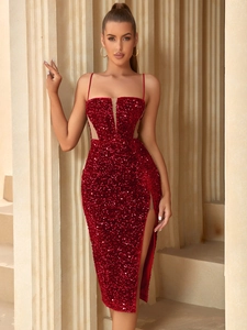 Detail view of shimmering red sequin dress with mesh inserts and sexy high side slit