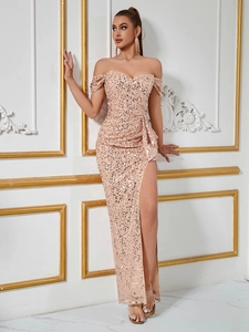 Detailed close-up of champagne sequin evening gown with side slit and waist draping