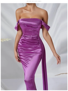 Detail view of purple satin off-shoulder dress with elegant pleats and waist draping