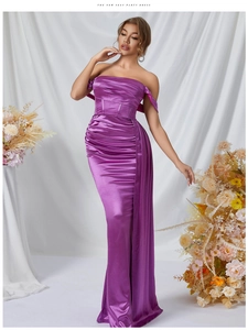 Detail of elegant purple satin evening dress with structured bodice and draped fabric
